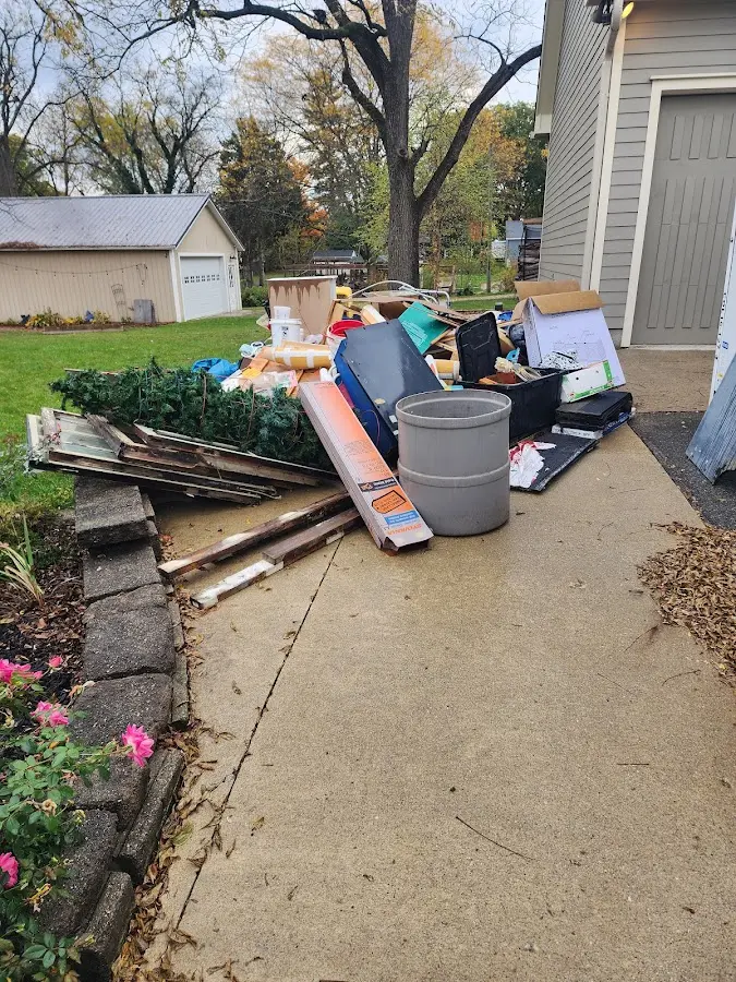 Dumpster being loaded with debris for Roofing Dumpster Rental in Mountain View Acres